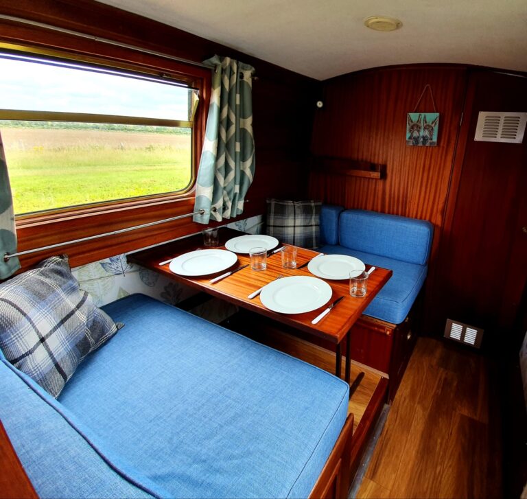 Dining area in a narrowboat 768x727